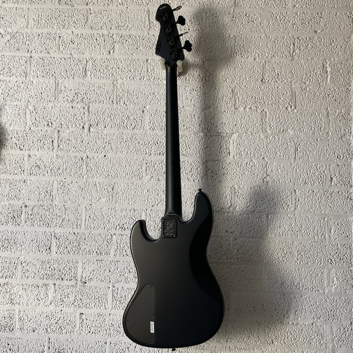 Atelier Z M#245 Custom 4-string bass in Matt Black with matching headstock and black hardware back view
