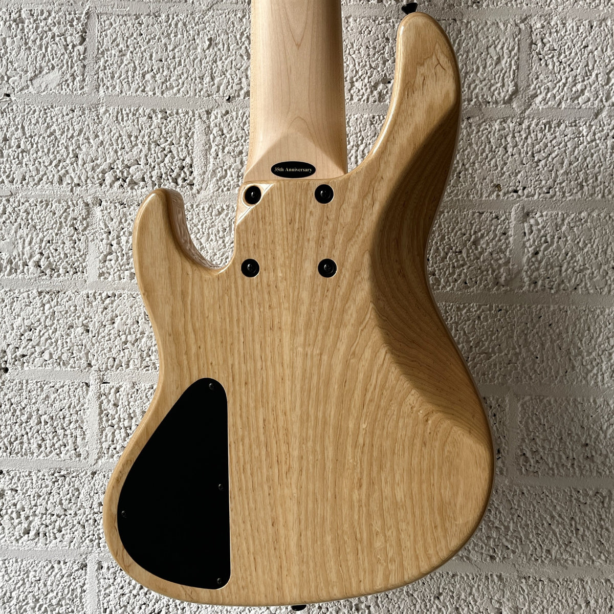 Atelier Z Beta6 6-string bass in Natural finish with black hardware body closeup back view
