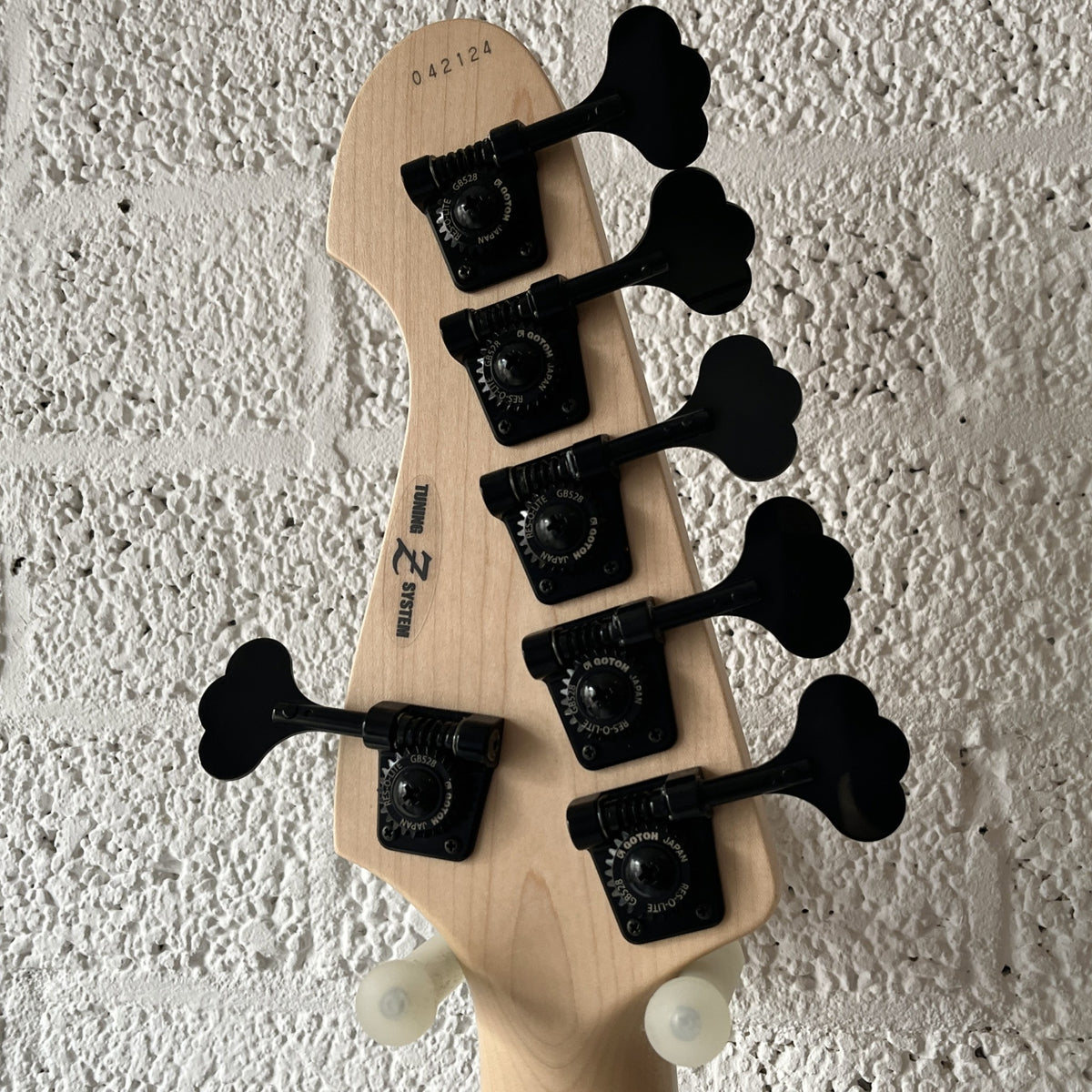 Atelier Z Beta6 6-string bass in Natural finish with black hardware body closeup headstock back view