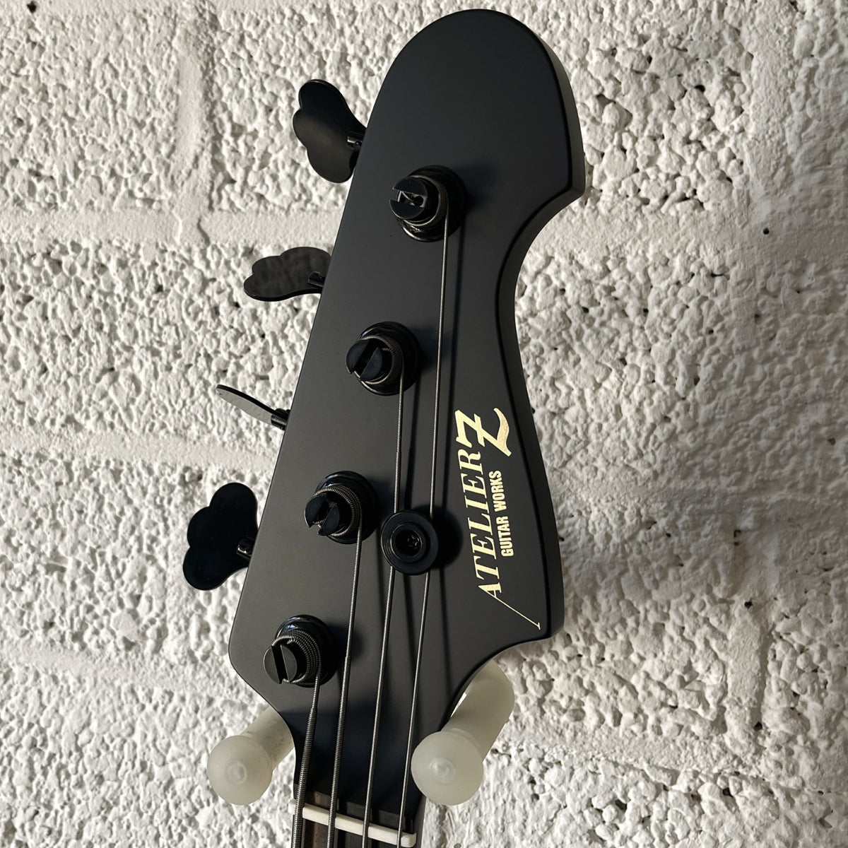 Atelier Z M#245 Custom 4-string bass in Matt Black with matching headstock and black hardware headstock