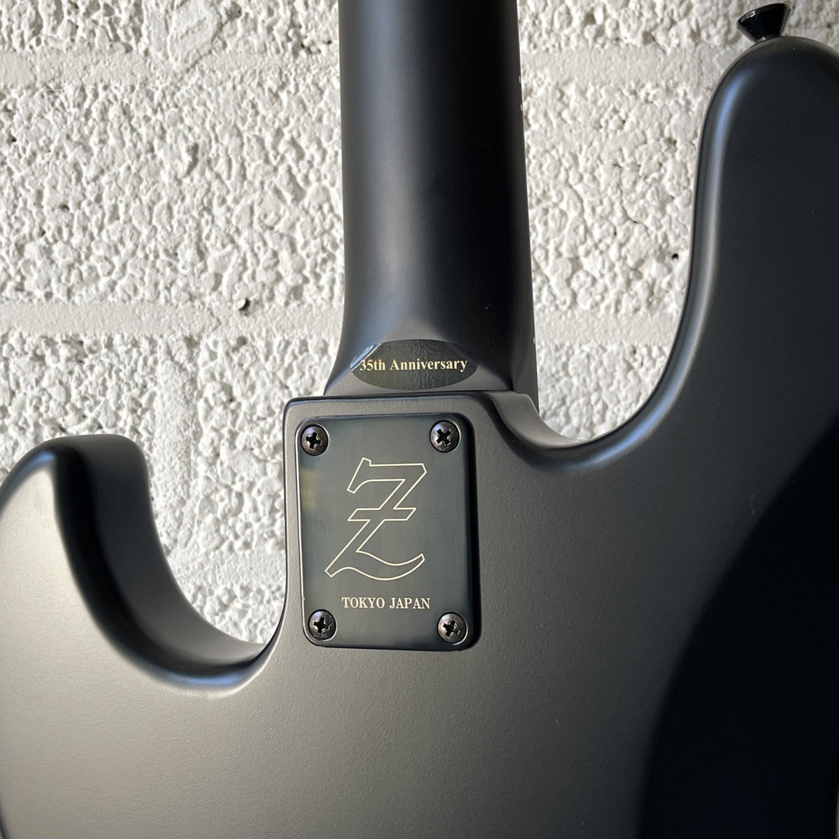 Atelier Z M#245 Custom 4-string bass in Matt Black with matching headstock and black hardware neck plate