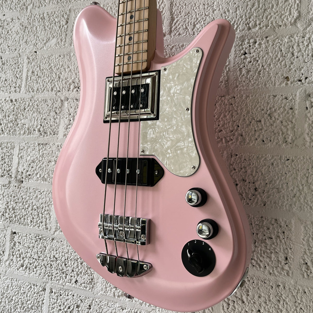 oopegg stormbreaker bass pearl pink pearloid pickguard body closeup angled up and right